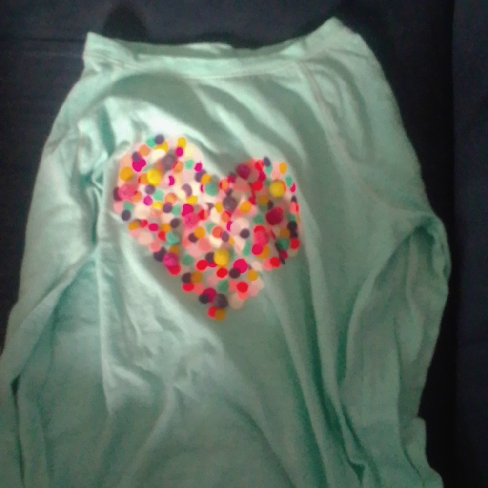 A blue and colorful girls shirt